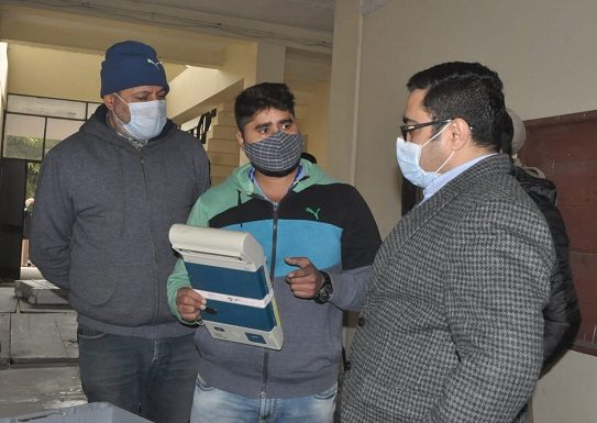 Additional District Electoral Officer Vishesh Sarangal conducts the first level checking of Electronic Voting Machines (EVMs)